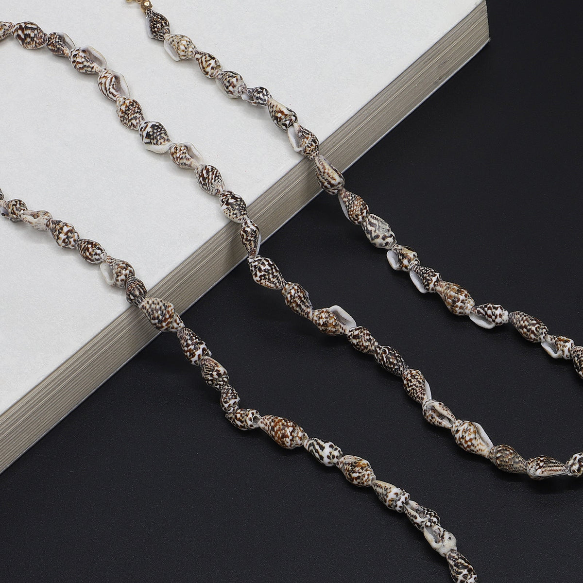Chaîne de lunettes inspirée des coquillages