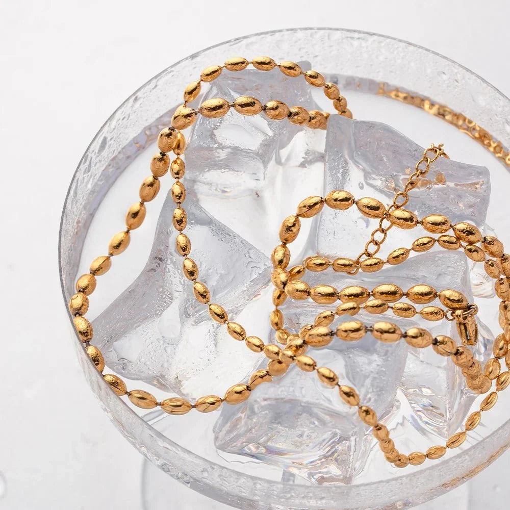 Collier superposé de perles dorées 18k