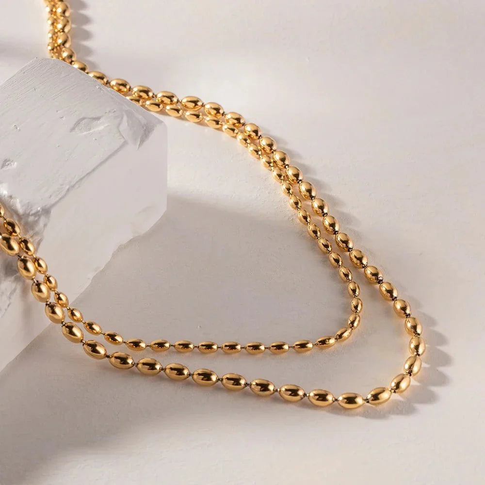 Collier superposé de perles dorées 18k