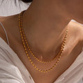 Collier superposé de perles dorées 18k