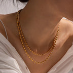 Collier superposé de perles dorées 18k