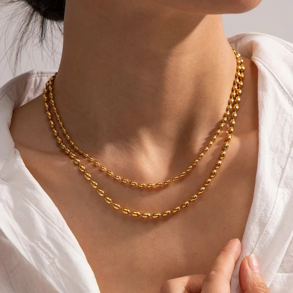 Collier superposé de perles dorées 18k