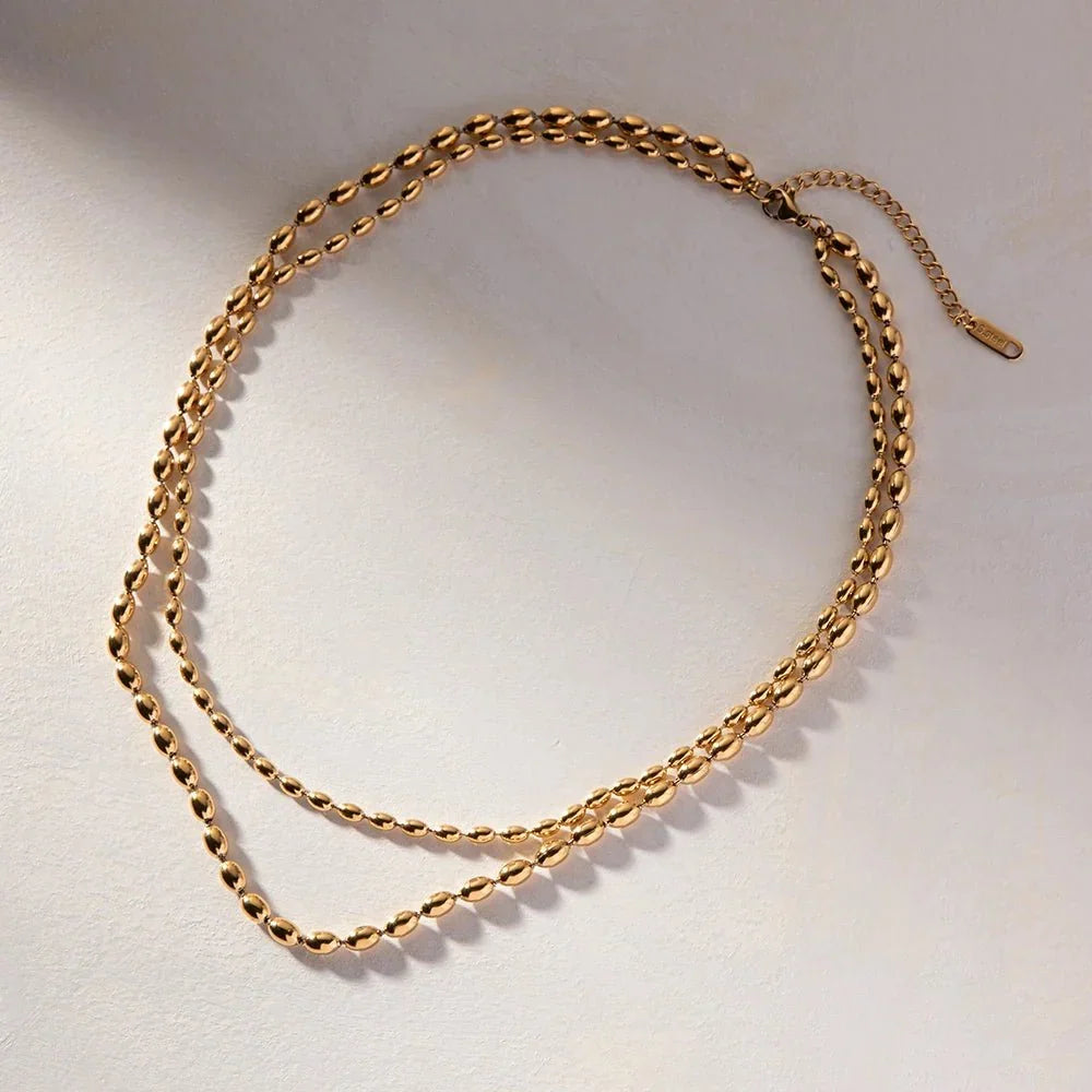 Collier superposé de perles dorées 18k