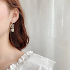 Boucles d'oreilles attrape-rêves avec cristal