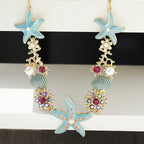 Collier perles, coquillage et étoile de mer