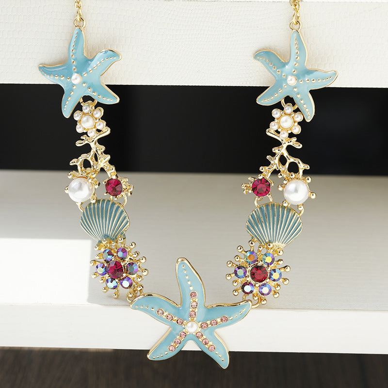 Collier perles, coquillage et étoile de mer