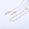 Collier avec perles et pendentifs transparents