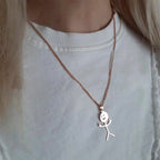 Collier à pendentif griffonné