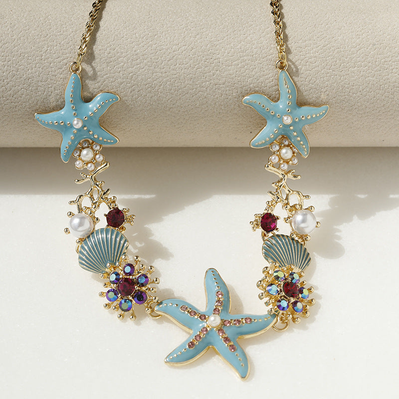 Collier perles, coquillage et étoile de mer