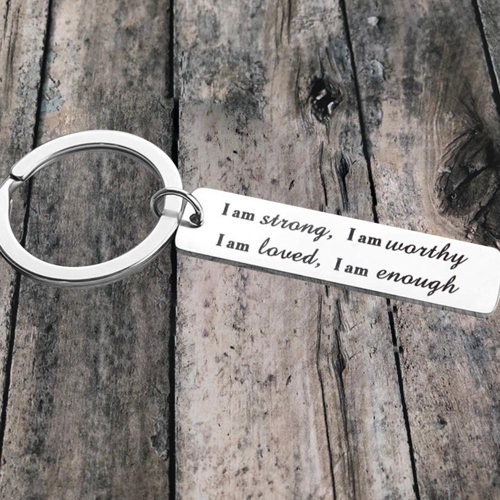 Porte-clés en acier inoxydable "I am strong"