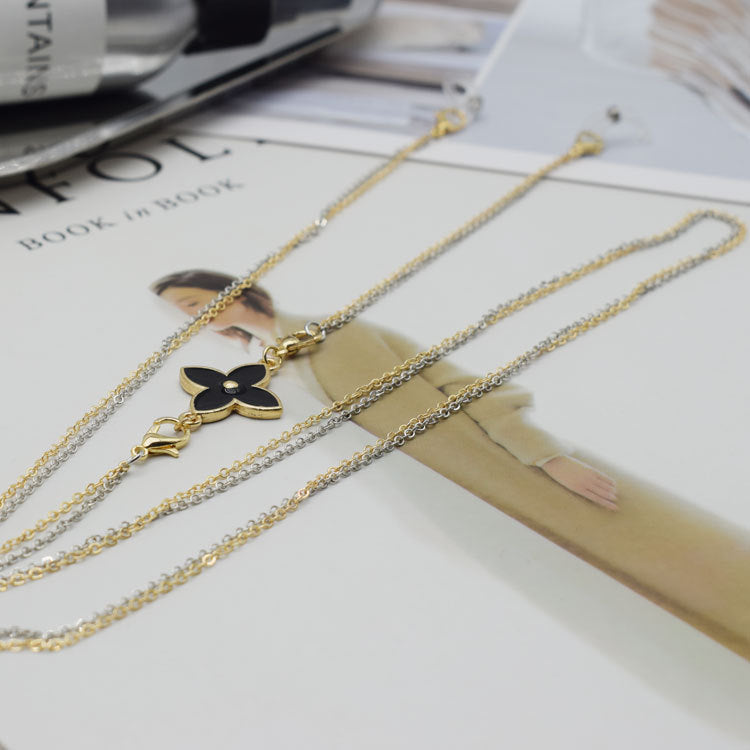 Collier à double rangée avec pendentif floral