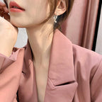 Boucles d'oreilles croisées tendance