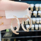 Boucles d'oreilles croisées tendance