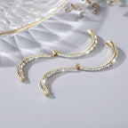 Boucles d'oreilles croisées tendance