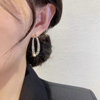 Boucles d'oreilles croisées tendance