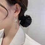 Boucles d'oreilles croisées tendance