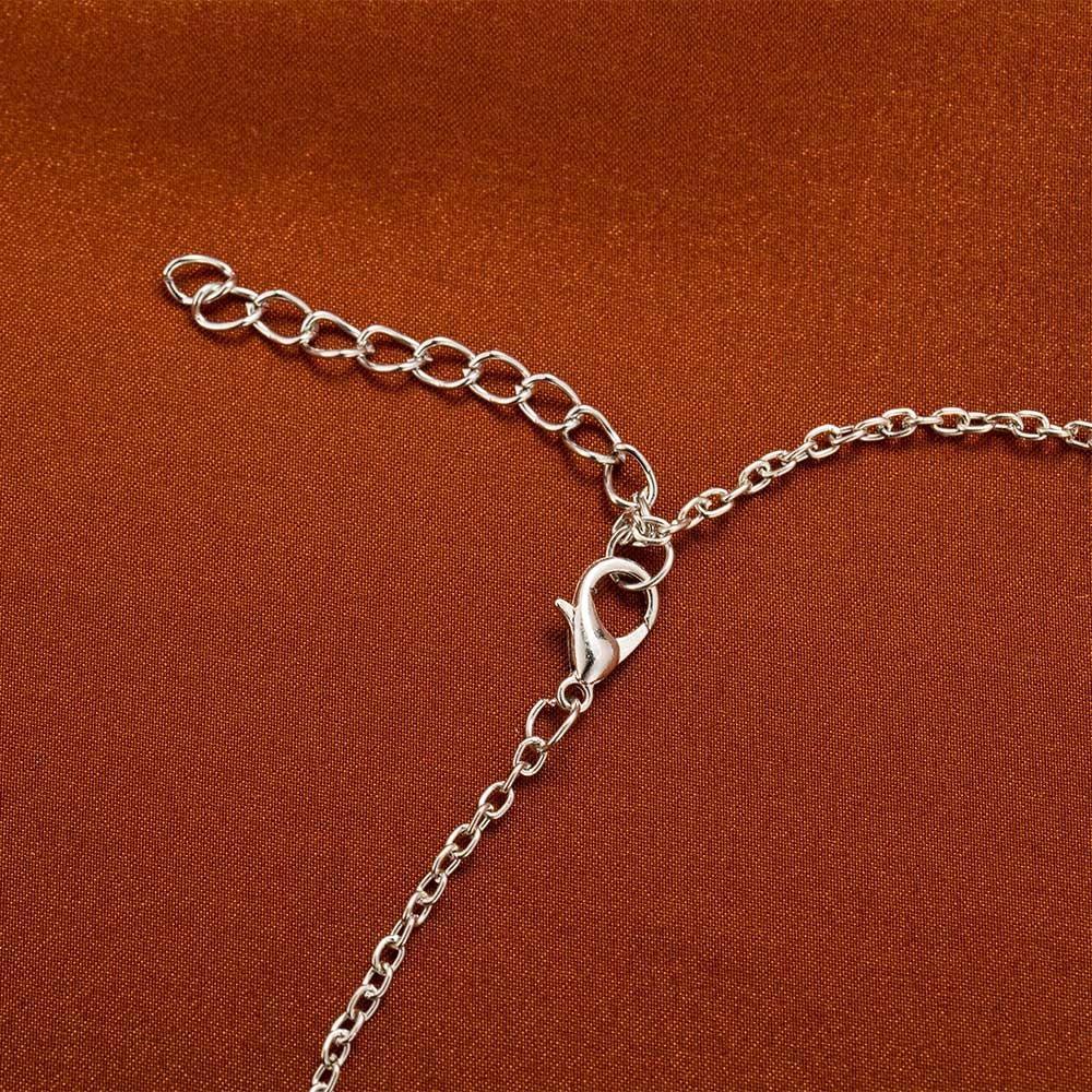 Collier long avec pendentif flocon de neige en strass