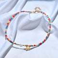 Collier de perles avec pendentif lettre