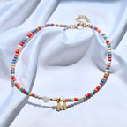 Collier de perles avec pendentif lettre