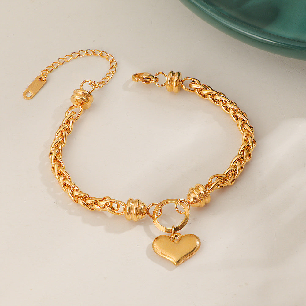 Bracelet pour femme avec pendentif cœur et tresse