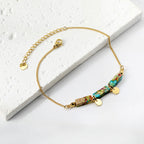 Bracelet pour femme avec éléments en pierre des Caraïbes et détails dorés