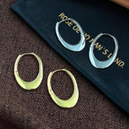 Boucles d'oreilles pendantes pour femme au design sculptural moderne