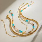 Collier pour femme avec perles et détails sphériques