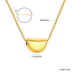 Collier pour femmes avec pendentif croix étincelant en acier inoxydable doré