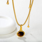 Collier pour femme avec pendentif anneau moderne et brillant en acier inoxydable