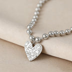 Collier pour femme avec pendentif cœur unique et perles brillantes