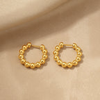 Boucles d'oreilles créoles perlées pour femme