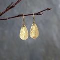 Boucles d'oreilles pendantes pour femme en métal texturé
