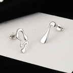 Boucles d'oreilles pour femme au design fluide créatif