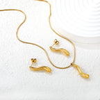 Parure de bijoux pour femme avec pendentif élégant et boucles d'oreilles