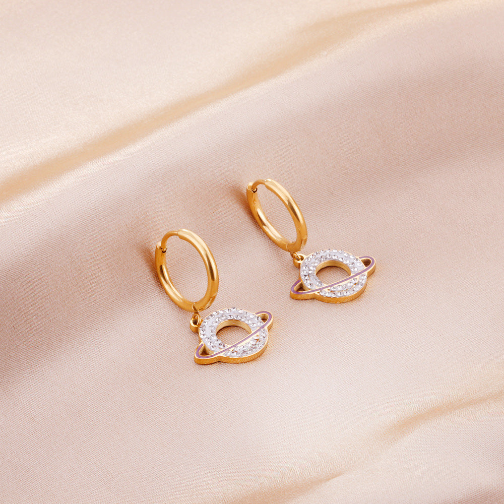 Boucles d'oreilles pendantes pour femme design planétaire en acier doré