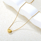 Collier pour femmes avec pendentif croix étincelant en acier inoxydable doré
