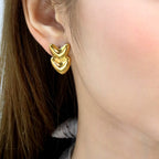 Boucles d'oreilles pendantes pour femme avec double cœur en acier inoxydable