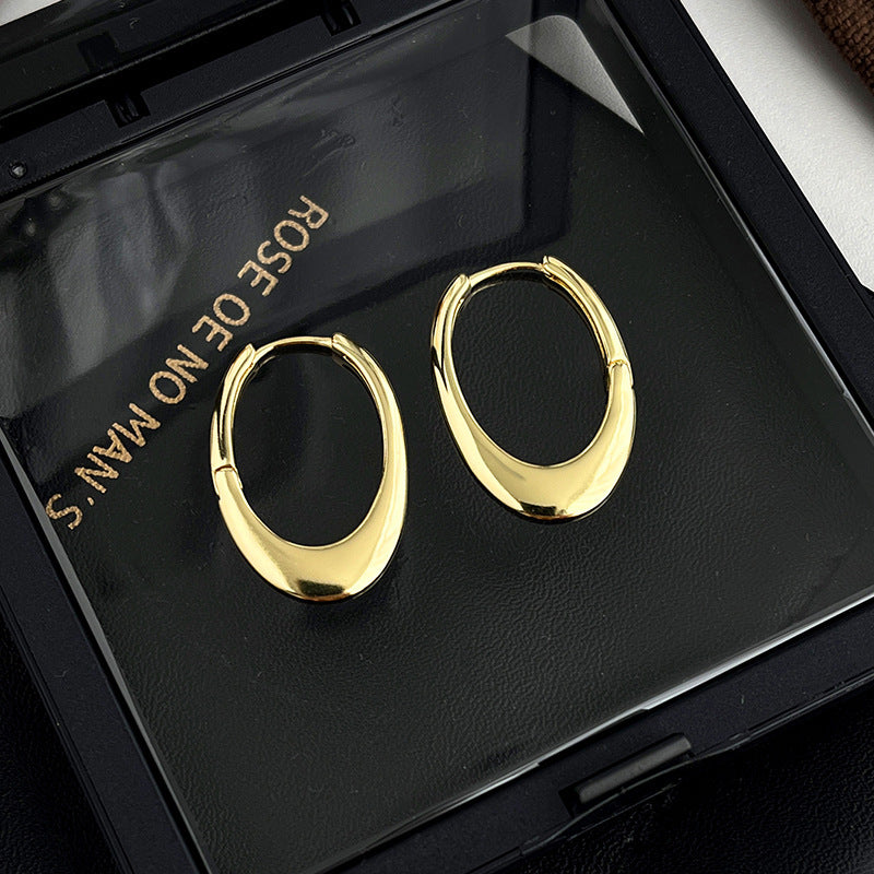 Boucles d'oreilles pendantes pour femme au design sculptural moderne