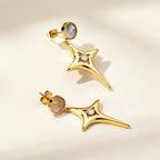 Boucles d'oreilles pendantes avec cristal et détail doré