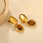 Boucles d'oreilles pendantes œil de tigre et cadre doré