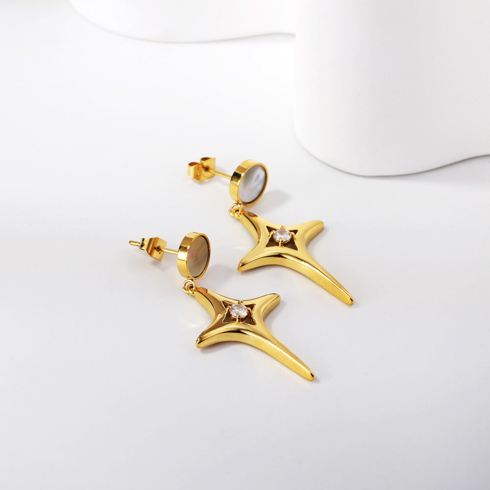 Boucles d'oreilles pendantes avec cristal et détail doré