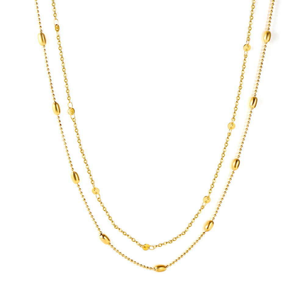 Collier pour femme avec motifs d'yeux et chaîne en acier inoxydable doré