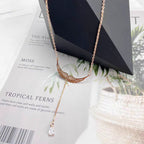 Collier pour femme avec design ailes d'ange et zircons étincelants