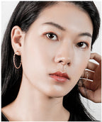 Boucles d'oreilles pour femme au design incurvé moderne