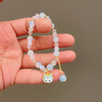 Bracelet fantaisie avec perles en verre colorées et pendentif