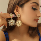 Boucles d'oreilles pendantes pour femme motif feuille
