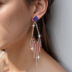 Boucles d'oreilles statement étincelantes avec longs pompons en strass