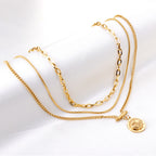 Collier multi-rangs pour femme avec pendentif boussole