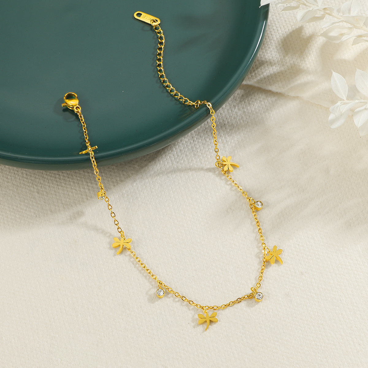 Chaîne de cheville pour femme motif floral et cristaux