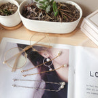 Boucles d'oreilles pendantes élégantes avec perles